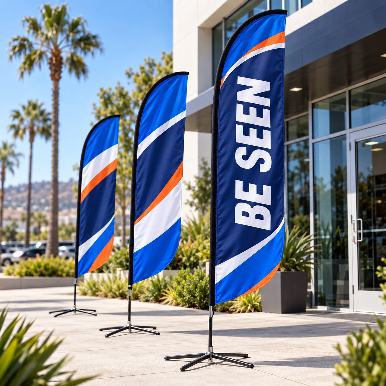 Custom feather flags printed with Be Seen outside a San Diego business
